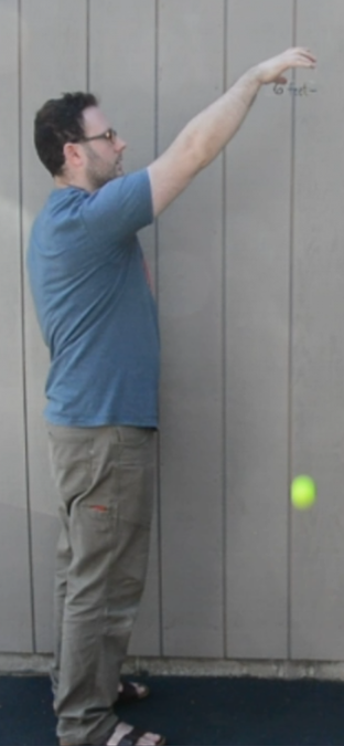 <p>A man dropping a ball. </p>
