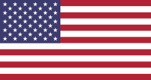 American flag. 13 stripes, 7 red, 6 white. Blue rectangle, top left corner. 50 white stars in blue rectangle. 