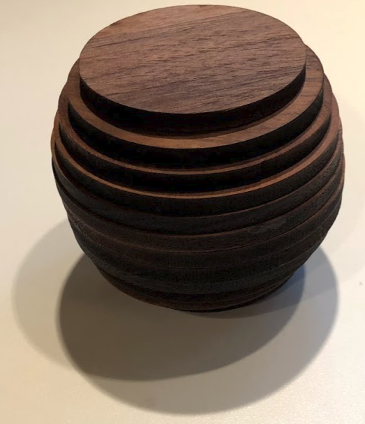 <p>Photograph of wooden cross sections forming sphere</p>
