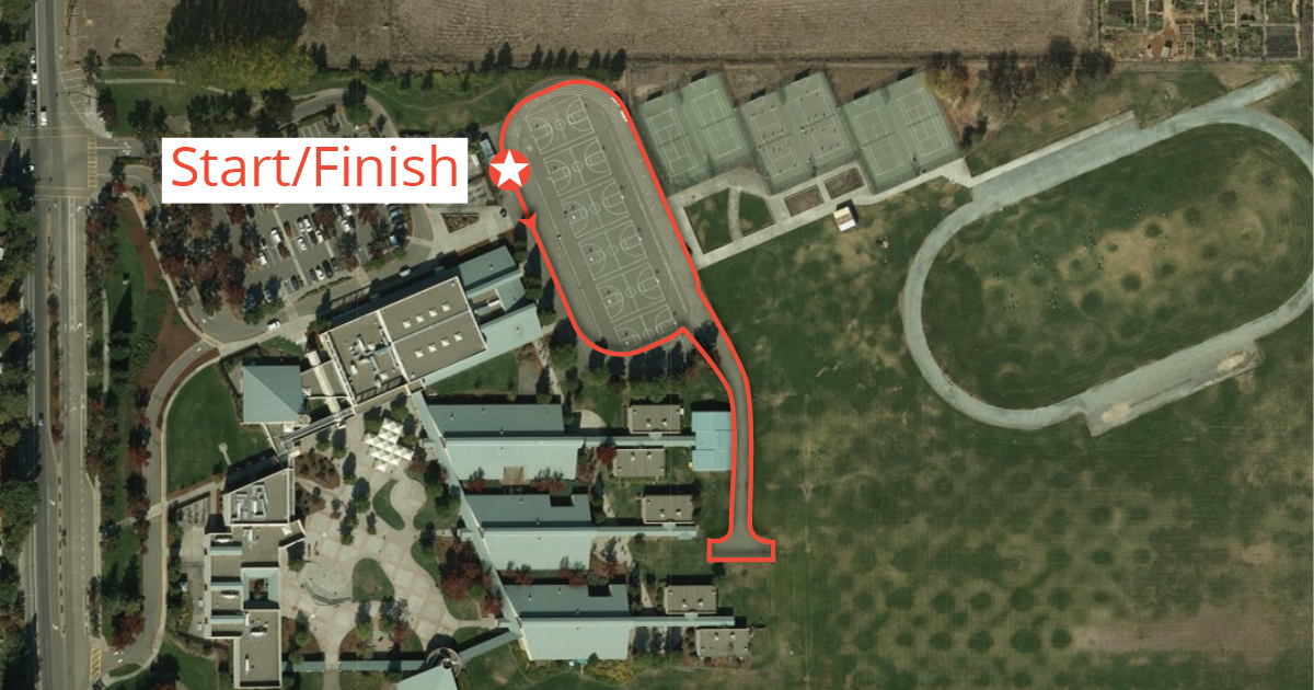 A satellite map of the school grounds is indicated. The 5K course around the oval track is outlined in red and a star is drawn to indicate the start and finish of the race.