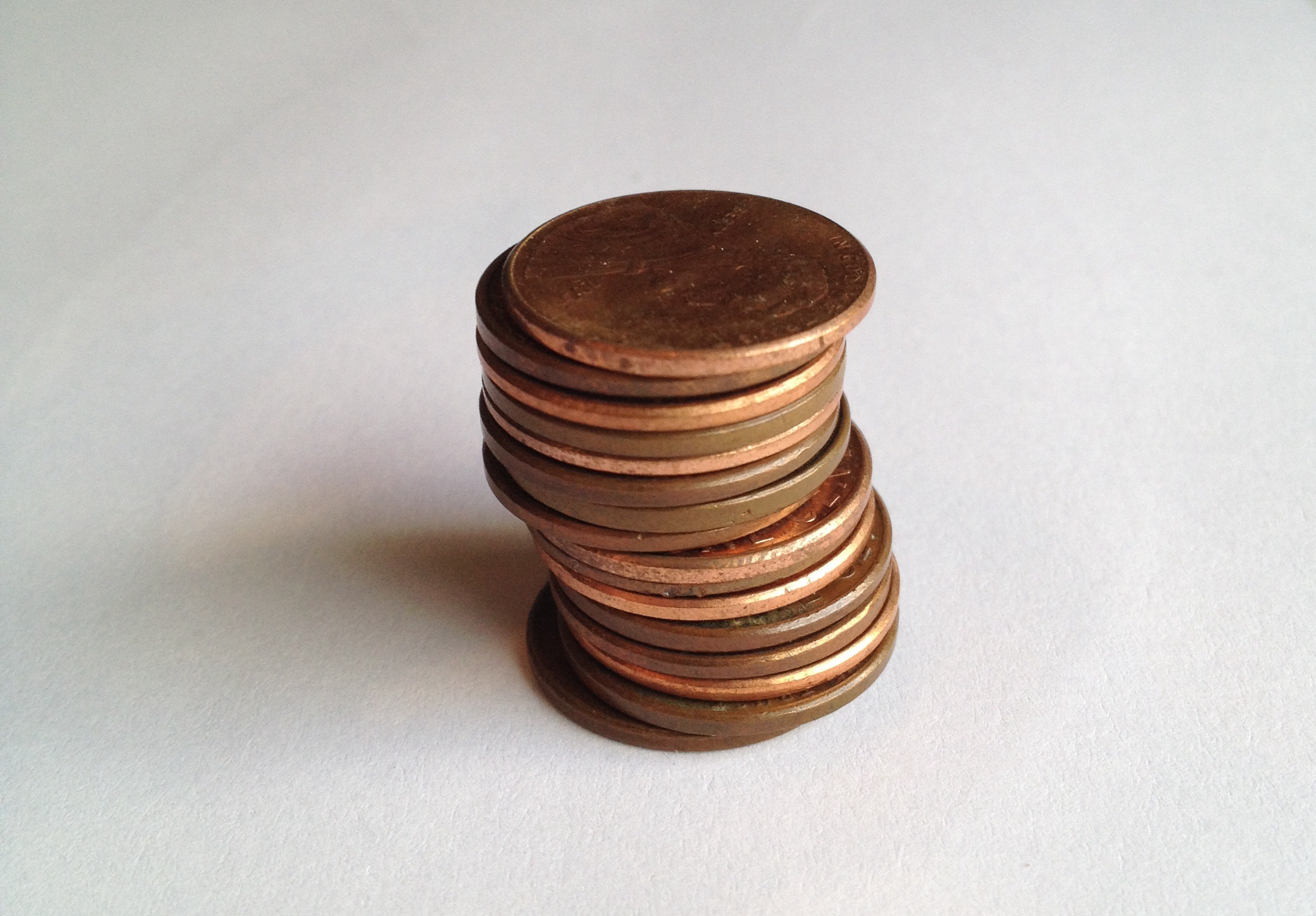 <p>Photograph of a stack of 15 pennies.</p>

