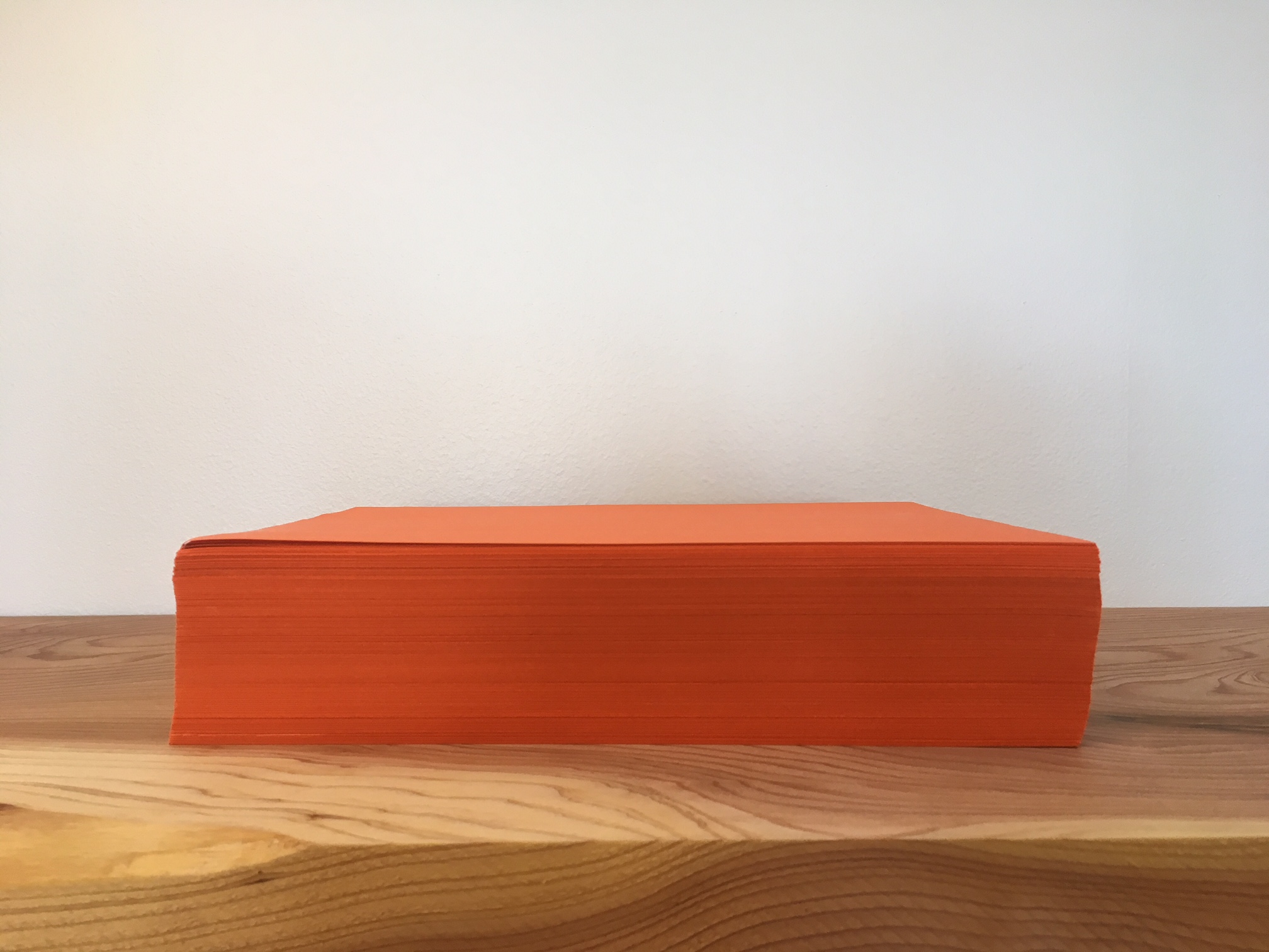 <p>A ream of orange paper. </p>
