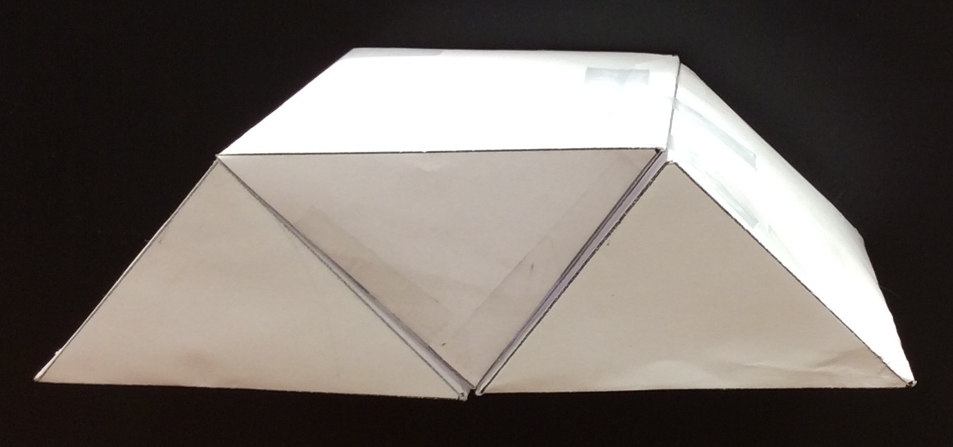 <p>A photo graph of paper prisms stacked.</p>
