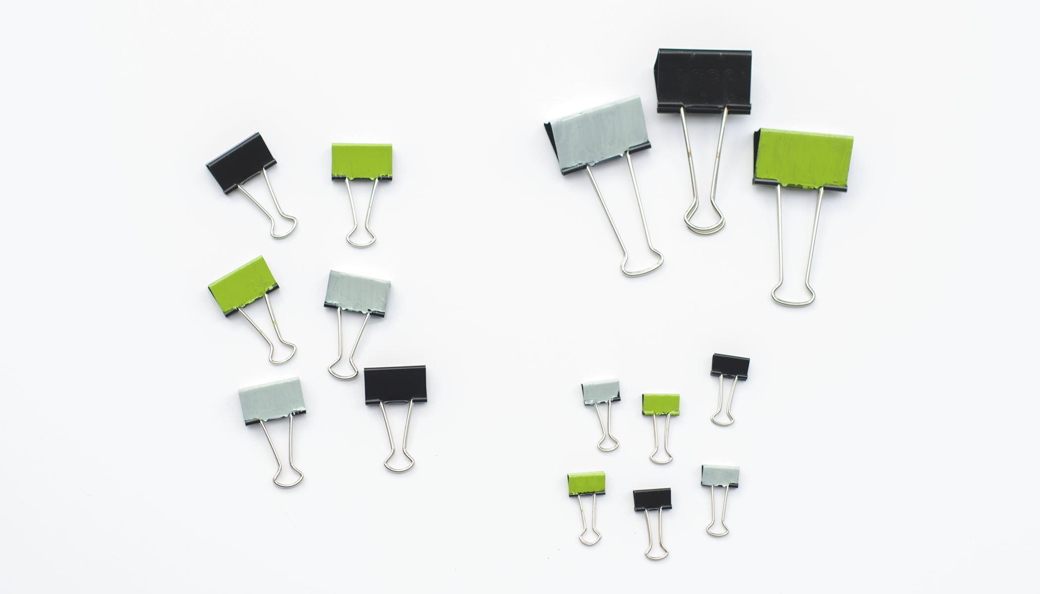 <p>A collection of binder clips. </p>
