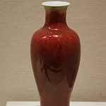 <p>An image of a red vase.</p>
