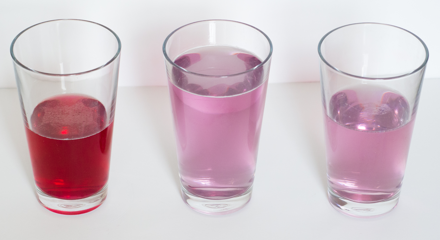 Picture of 3 glasses containing drink mixtures.