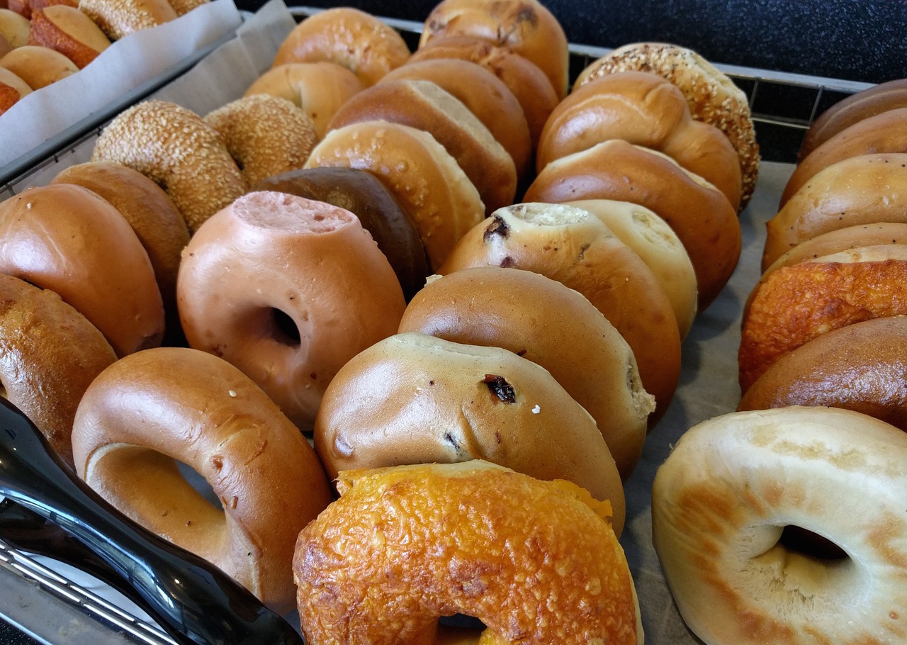 <p>Trays of bagels at a bagel shop.</p>
