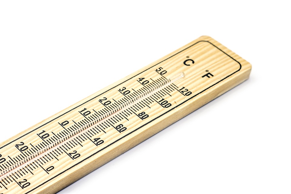<p>a wooden thermometer</p>
