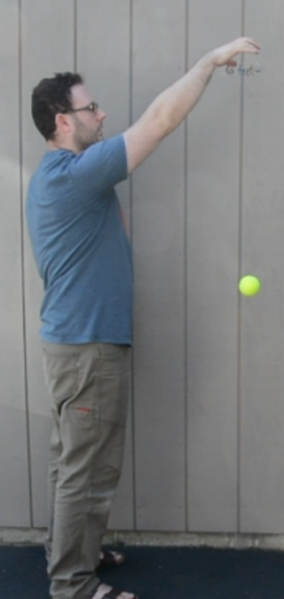 <p>A man dropping a ball. </p>
