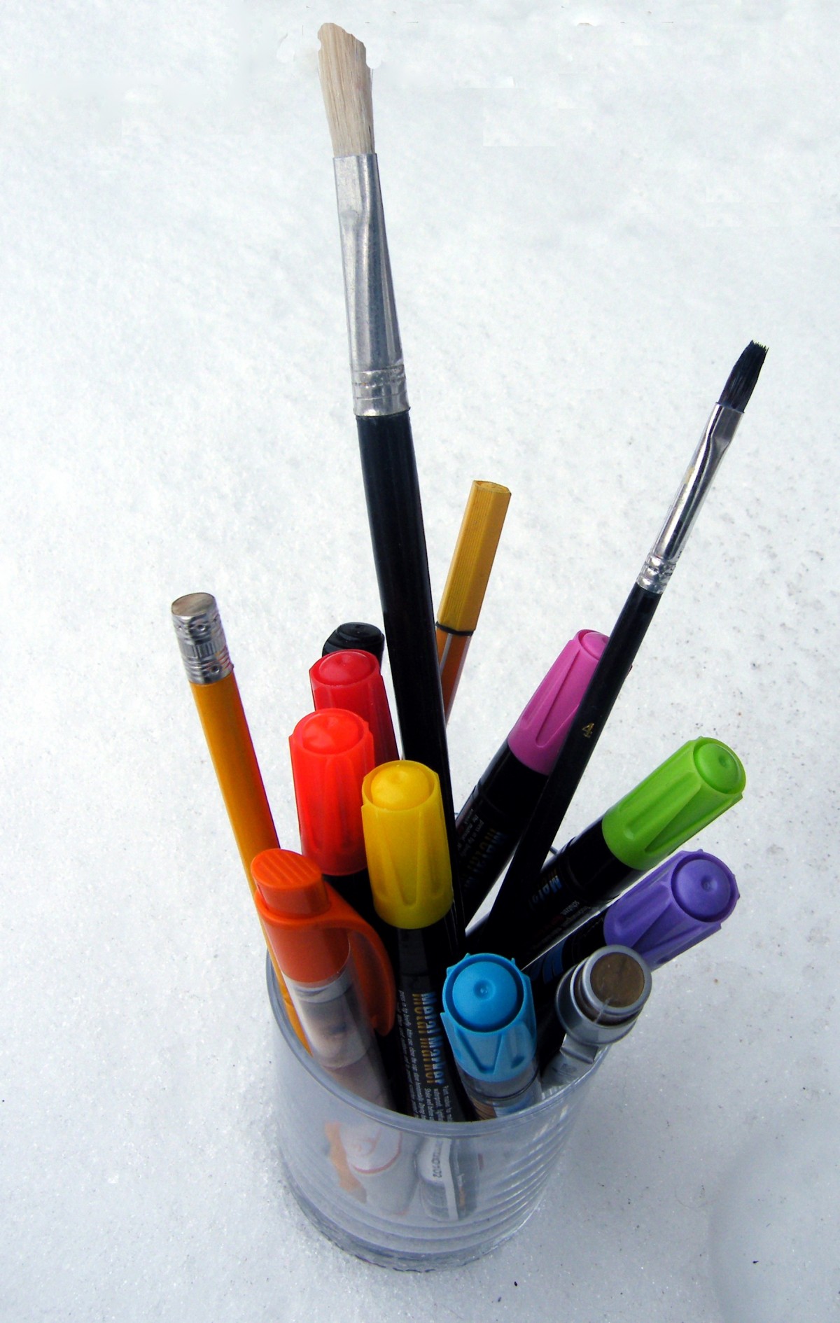 <p>Pens and pencils in a cup.</p>
