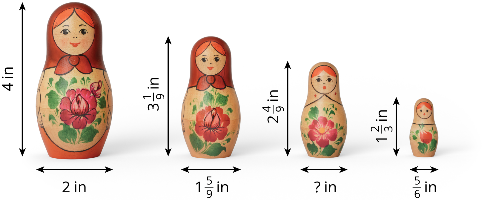 Four wooden dolls of different sizes.