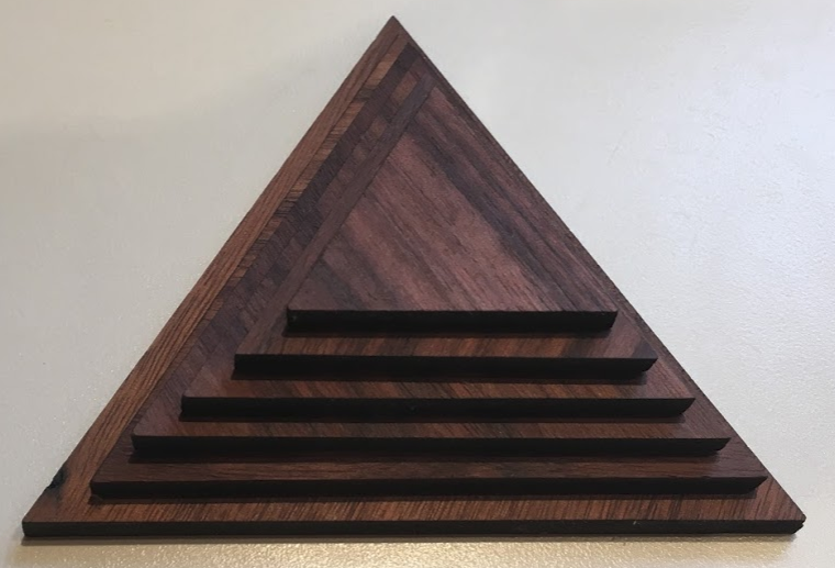<p>Photograph of portion of wooden pyramid </p>
