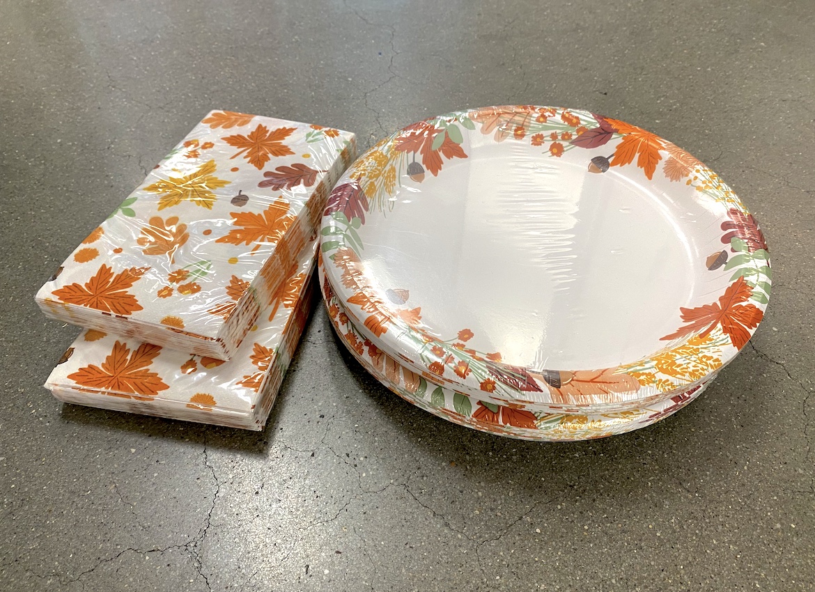 <p>Photo of paper napkins and paper plates</p>
