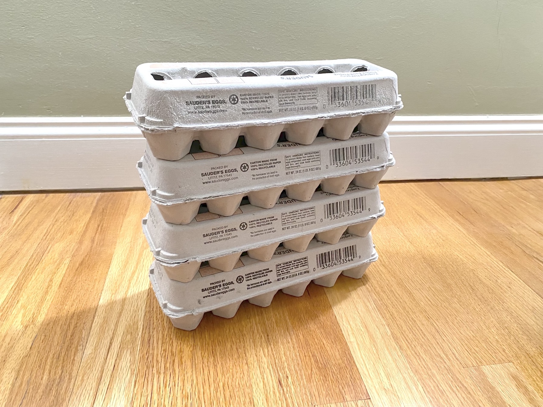<p>Photograph of a stack of egg cartons.</p>
