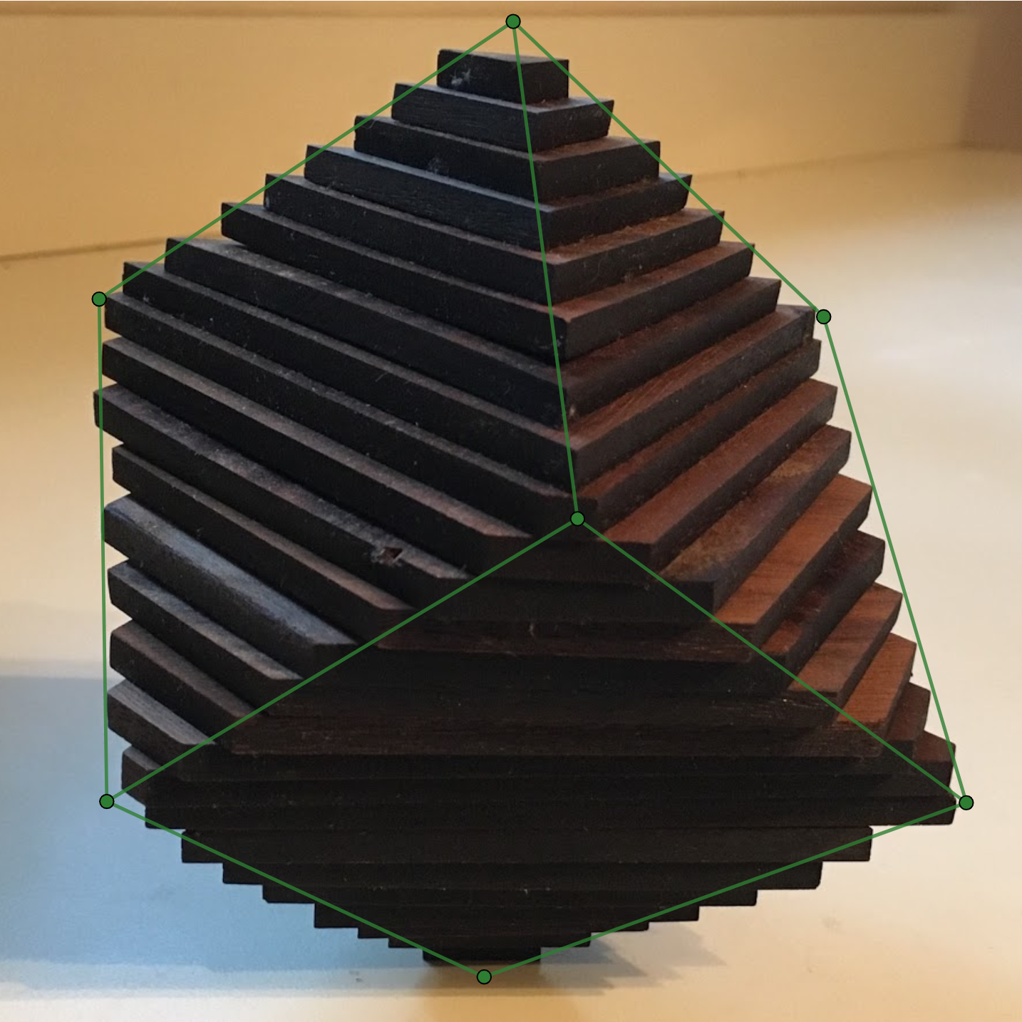 <p>Photograph of Wooden stacks forming a cube </p>
