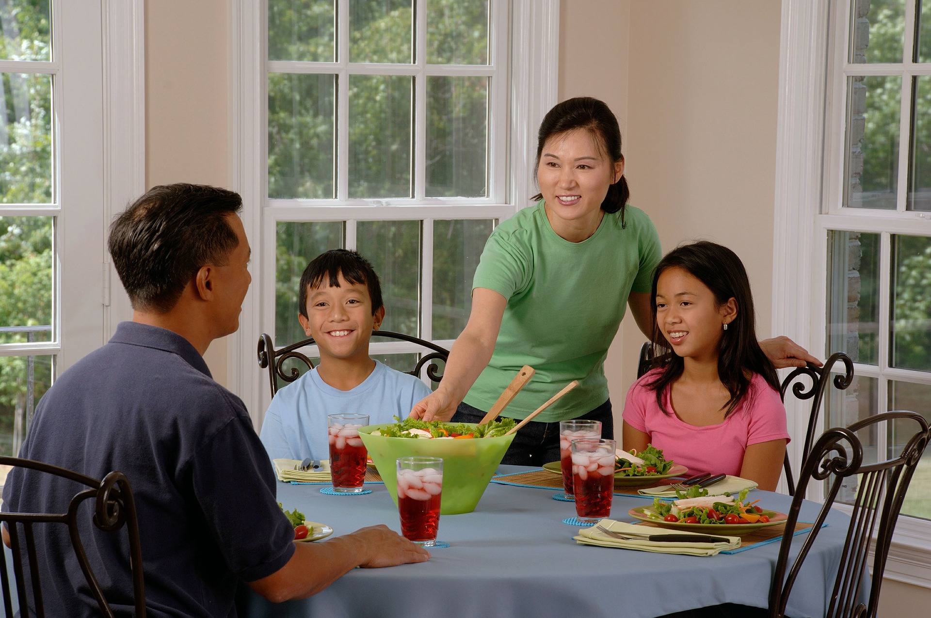 <p>A photo of a family eating dinner</p>
