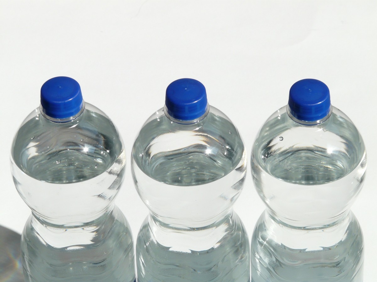 <p>A photograph of water bottles arranged in rows.</p>
