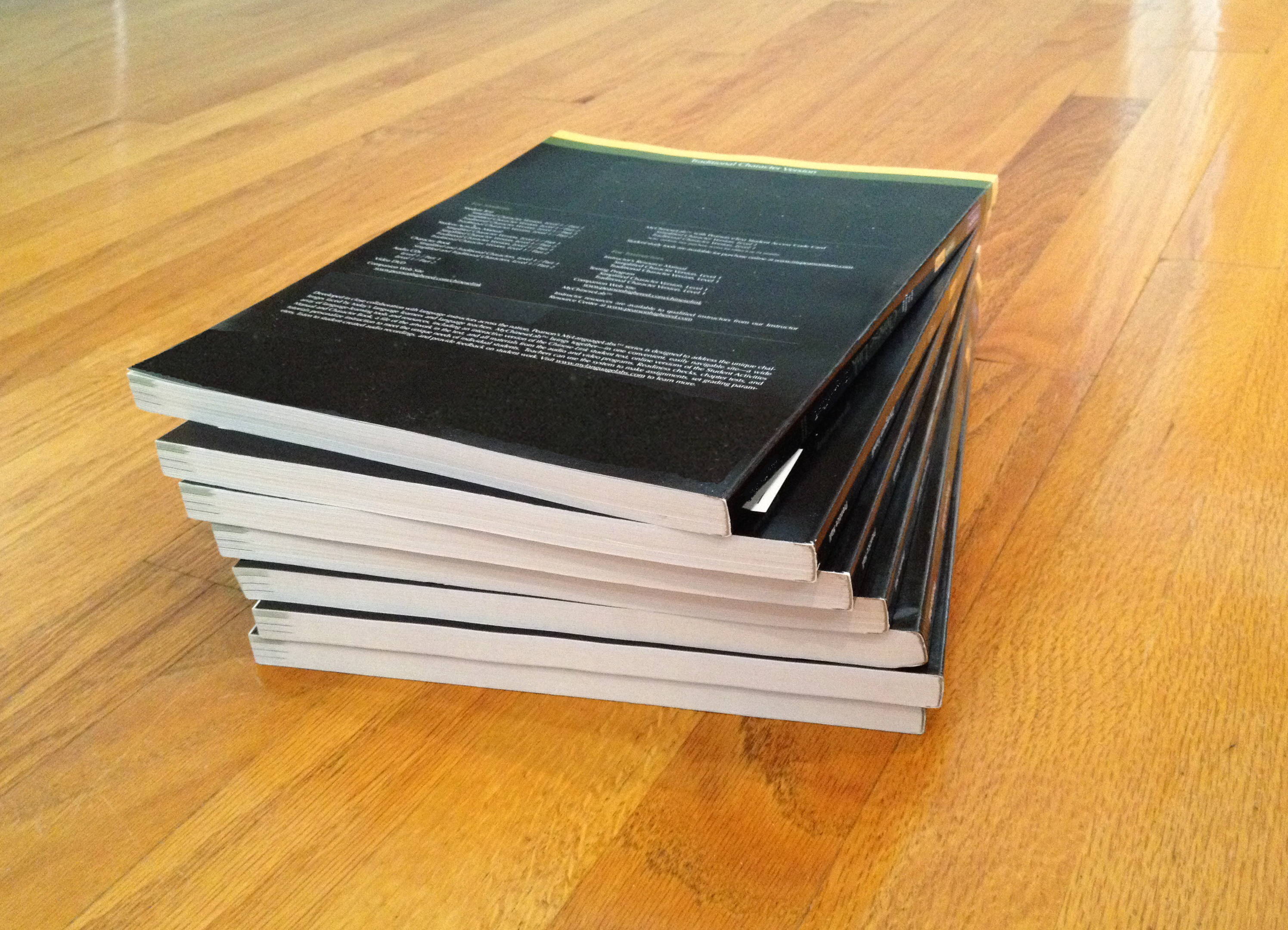 <p>Photograph of a stack of 7 notebooks.</p>

