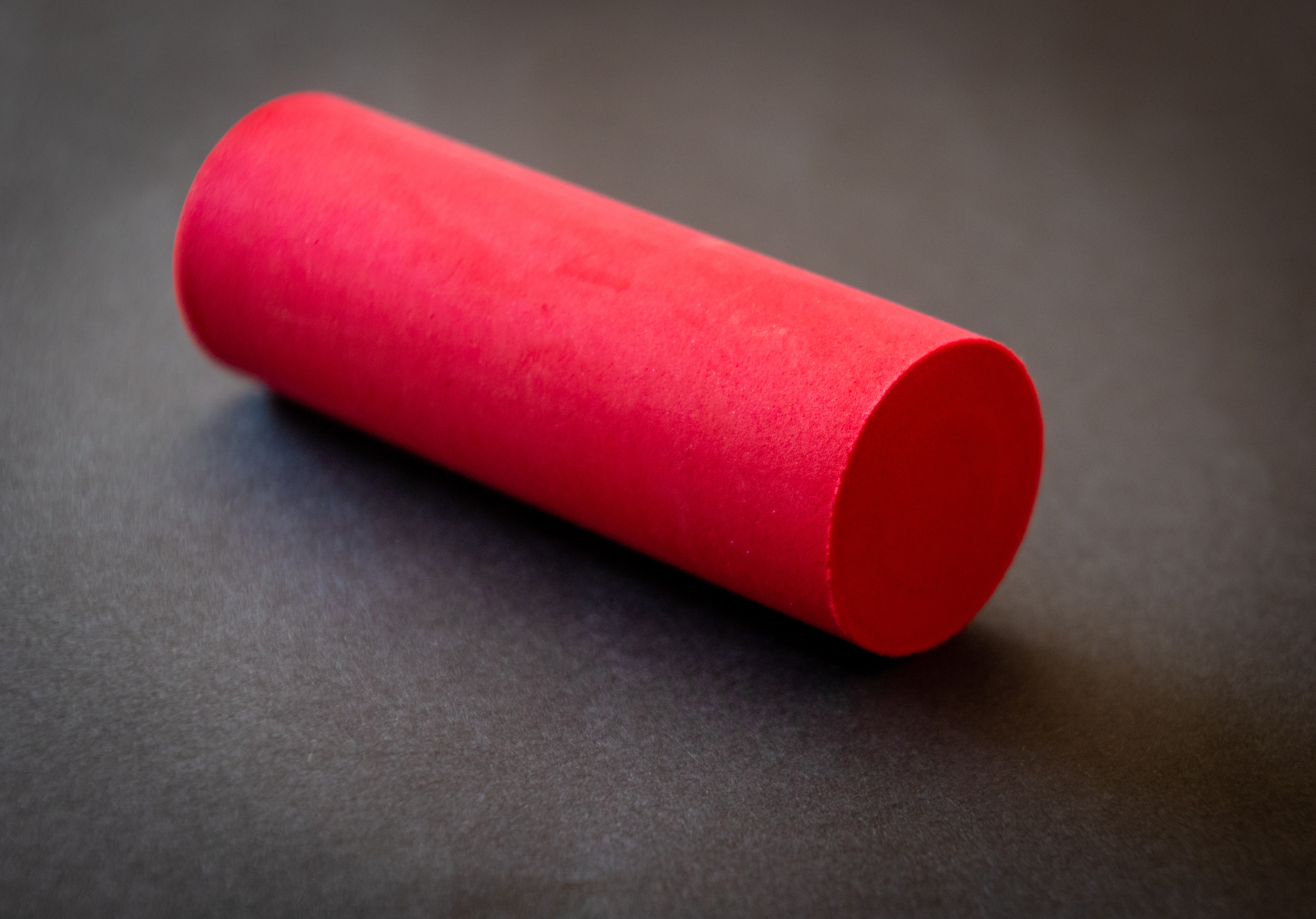 <p>A photo of a piece of red chalk</p>
