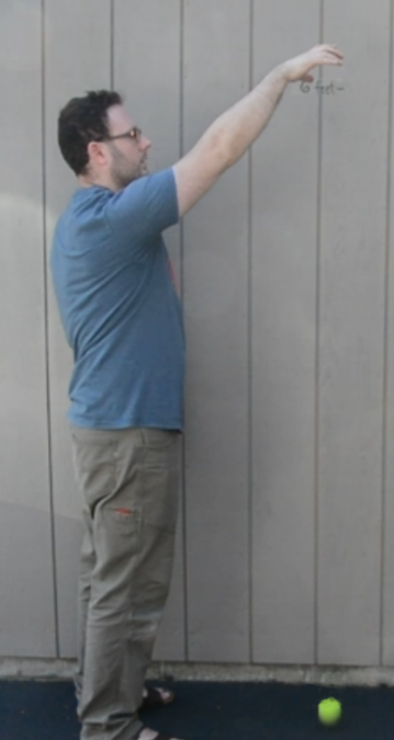 <p>A man dropping a ball. </p>
