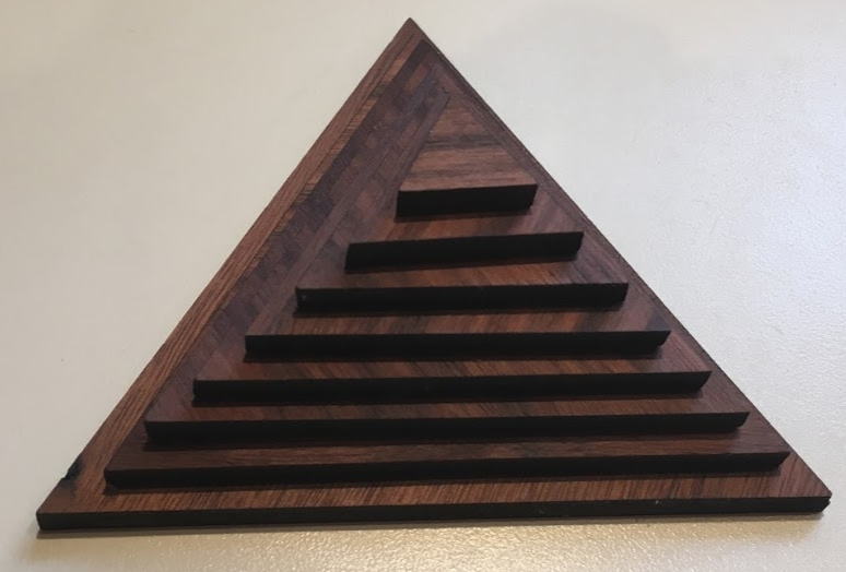 <p>Photograph of wooden pyramid </p>
