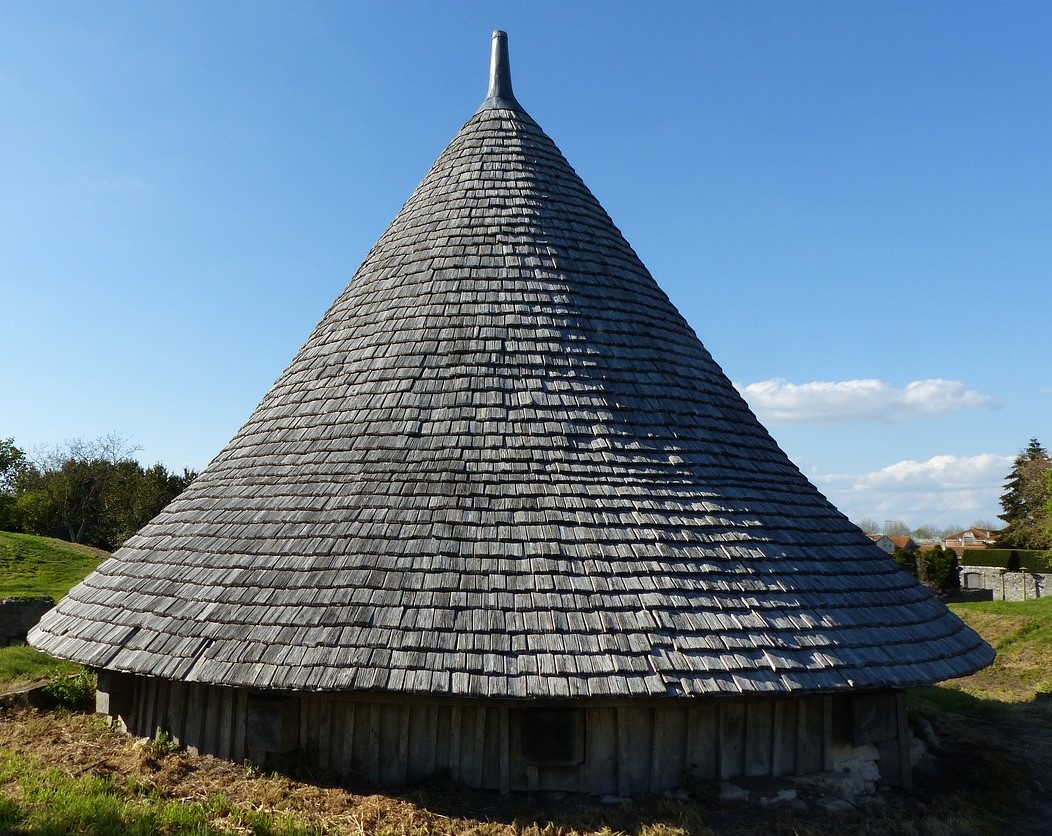 <p>A photo of a structure with a conical roof</p>
