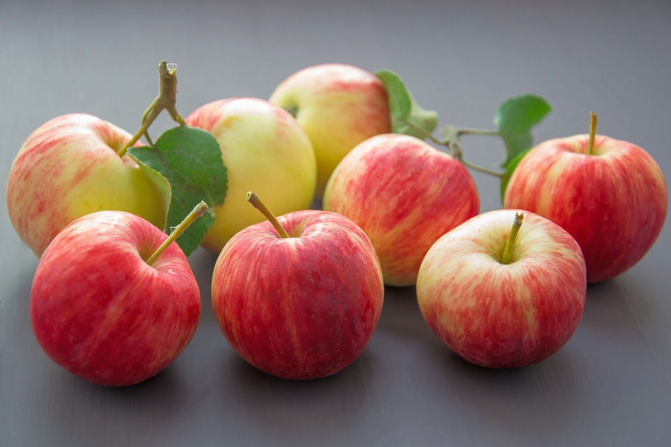 <p>eight red apples on neutral background</p>
