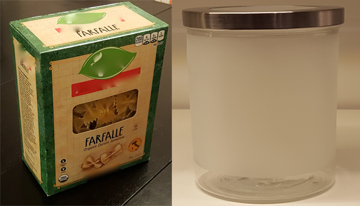 A photo of two objects. The object on the left is a box of pasta that is in the shape of a rectangular prism. The object on the right is an empty, cylindrical container.
